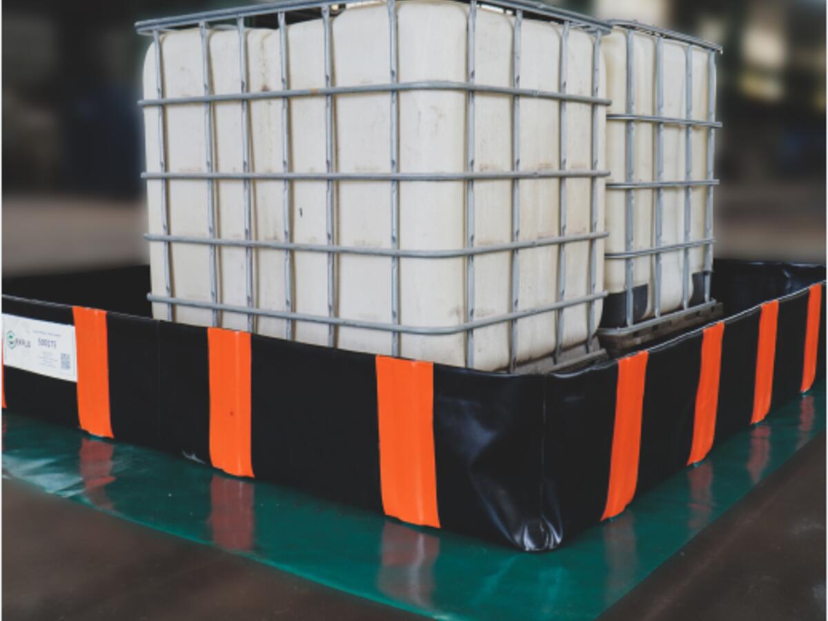 IBCs in a flexible spill tray in a commercial hall