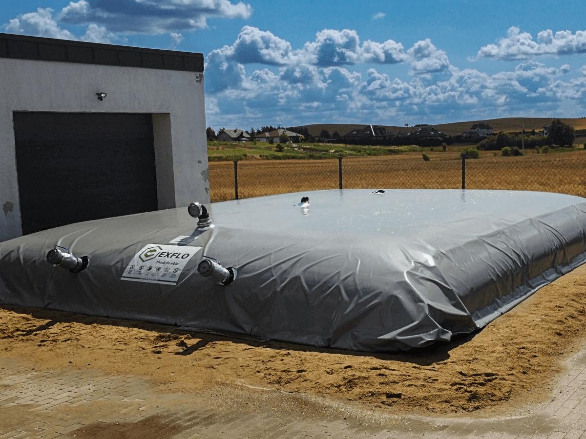 Flexible fire water tank next to a commercial building